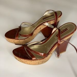 Wedge type heel; worn/used; cork and leather